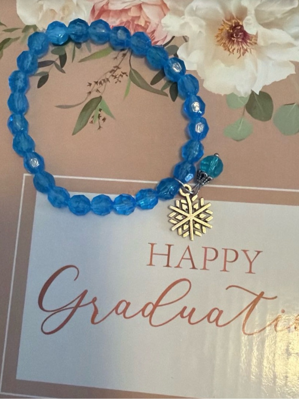 Bright Blue Beaded Bracelet with Snowflake Charm